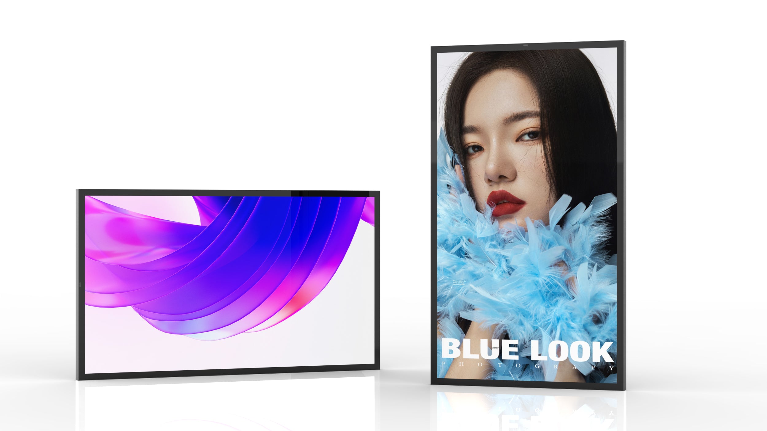 A landscape-oriented screen displaying abstract purple and blue swirls is next to a portrait-oriented screen featuring a woman with dark hair and bold red lipstick, partially covered by blue feathers, with the text 